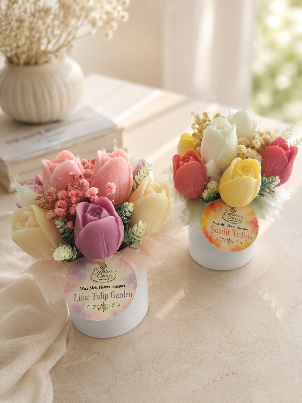 Two handcrafted Wax Flower Tulip Jars by Essence Cove, featuring the colorful Sunlit Tulips arrangement and the pastel Lilac Tulip Garden arrangement in white jars.