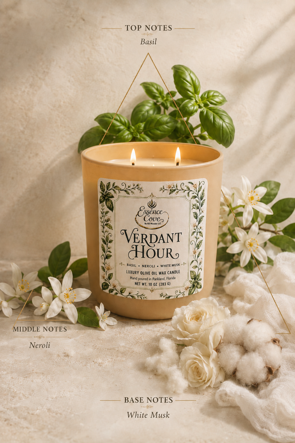 Essence Cove Verdant Hour 10 oz olive oil wax candle with double wick and gold lid surrounded by fresh basil and white flowers.