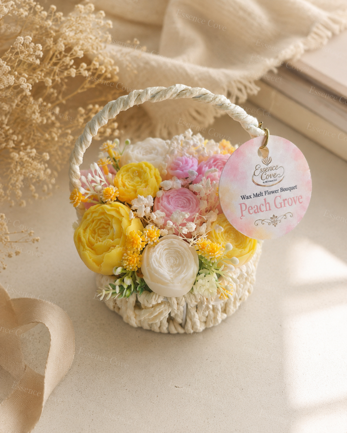 Two handcrafted Wax Flower Summer Baskets by Essence Cove, featuring the yellow and pink Peach Grove arrangement and the purple and green Lilac Meadow arrangement.