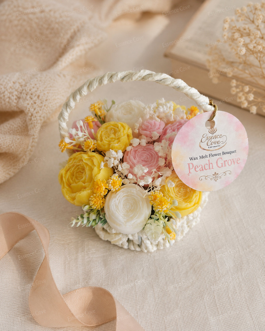 Two handcrafted Wax Flower Summer Baskets by Essence Cove, featuring the yellow and pink Peach Grove arrangement and the purple and green Lilac Meadow arrangement.